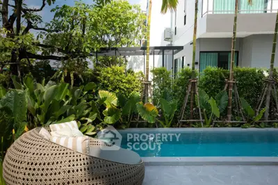 Luxurious modern villa with private pool and lush garden