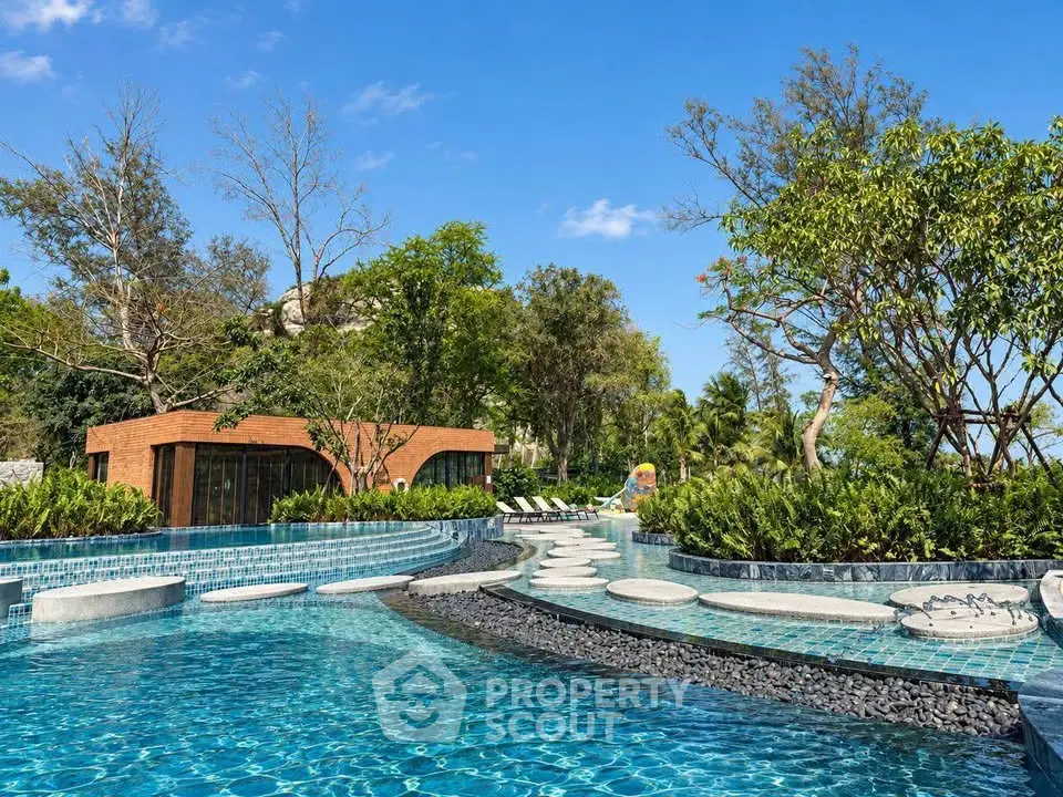 Luxurious outdoor pool area with lush greenery and modern design, perfect for relaxation and leisure.