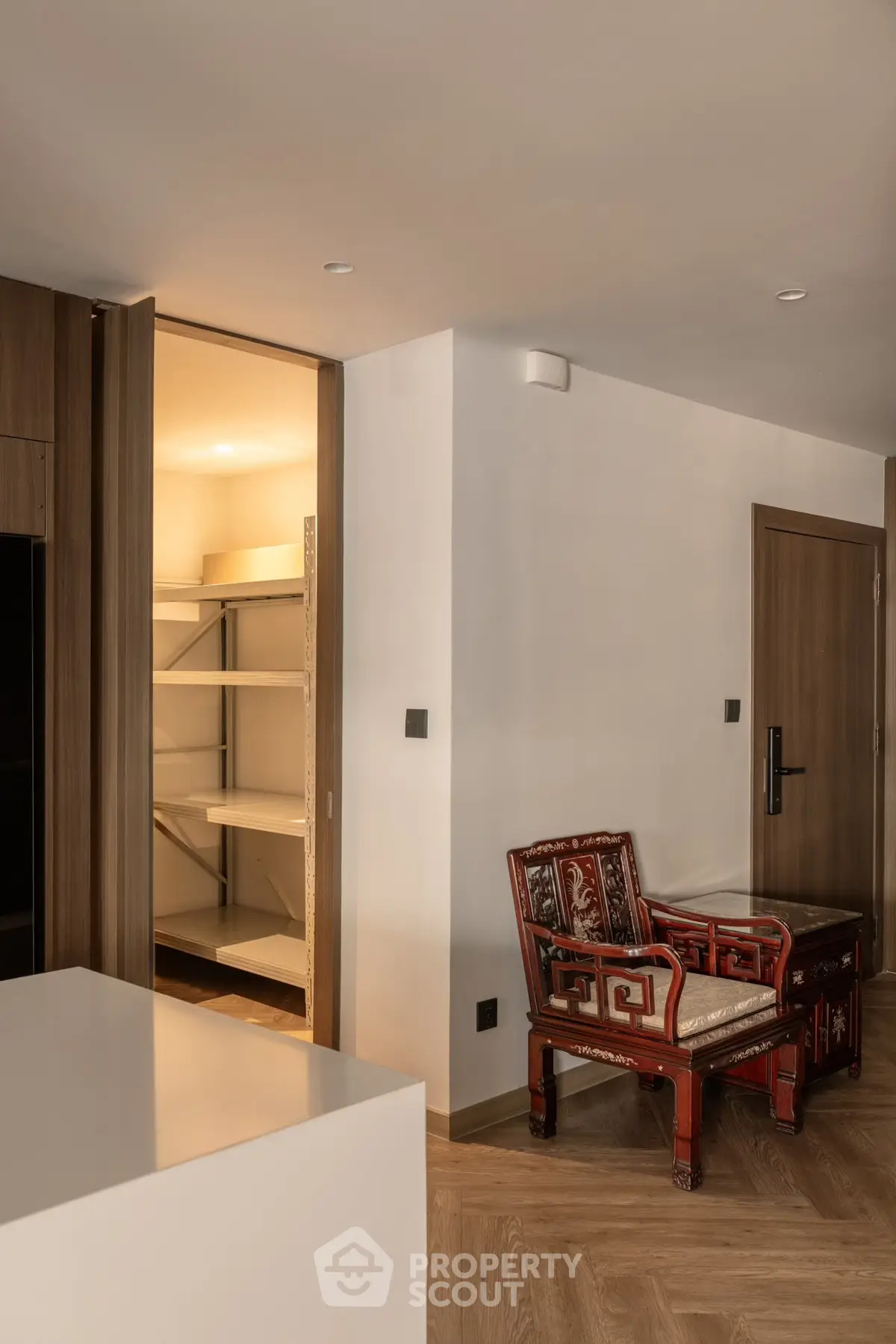 Elegant interior with wooden accents and open storage space in modern apartment