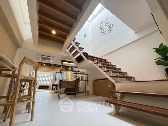 Modern interior with stylish staircase and open layout design