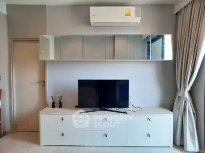Modern living room with sleek TV unit and air conditioning