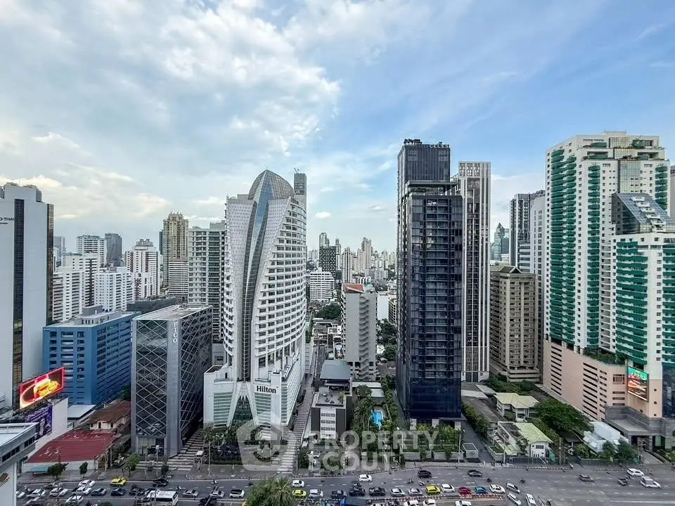 Stunning cityscape view showcasing modern high-rise buildings under a clear blue sky.