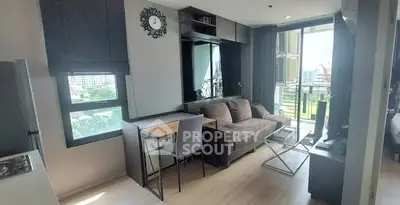 Modern living room with balcony and stylish decor in urban apartment