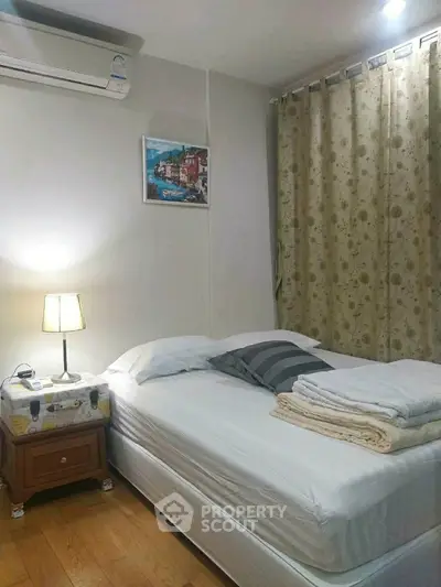 Cozy bedroom with air conditioning and elegant decor