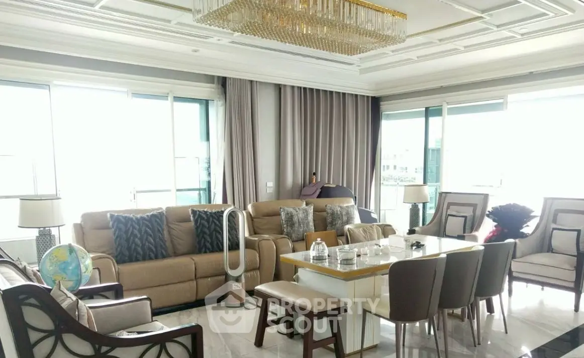 Luxurious living room with elegant chandelier and modern furniture
