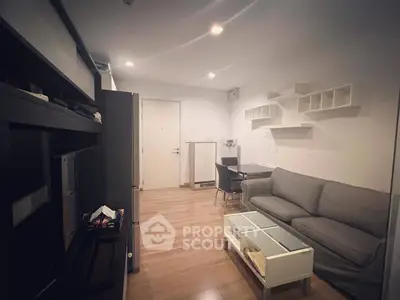 Cozy living room with modern furniture and wooden flooring, perfect for relaxation and entertainment.