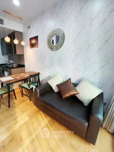 Stylish modern living room with marble accent wall and cozy leather sofa