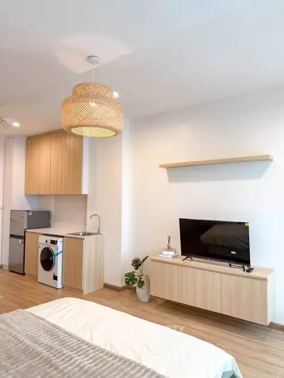 Modern studio apartment with stylish kitchen and cozy living area