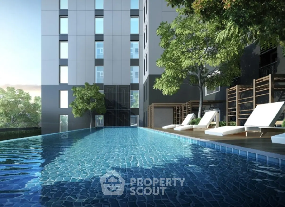 Luxurious apartment building with stunning poolside view and modern amenities.