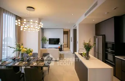 Luxurious open-plan living and dining area with modern kitchen in upscale apartment.