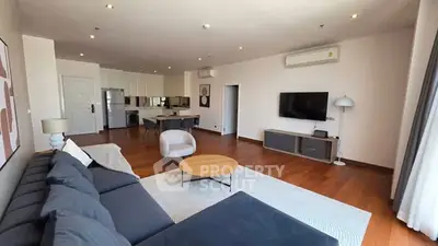 Spacious modern living room with open kitchen and stylish decor