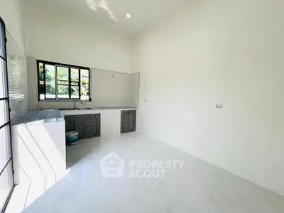Spacious kitchen with modern open layout and ample natural light
