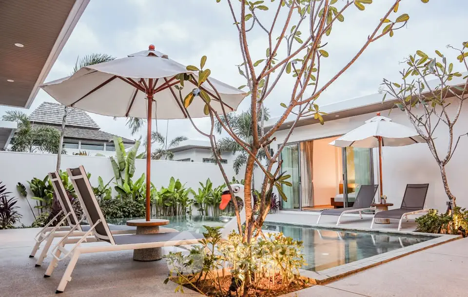 Luxurious modern villa with private pool and lush garden, perfect for relaxation and entertainment.