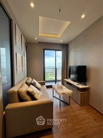 Modern living room with cozy sofa and city view through large window.