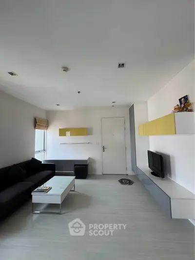 Modern living room with sleek furniture and minimalist design