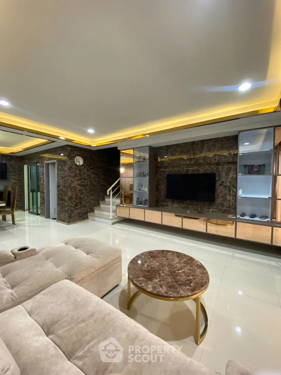 Luxurious modern living room with marble accents and elegant lighting