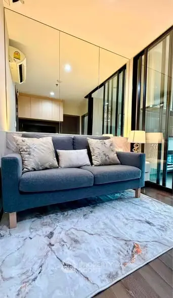Stylish modern living room with plush sofa and elegant decor in a contemporary apartment.