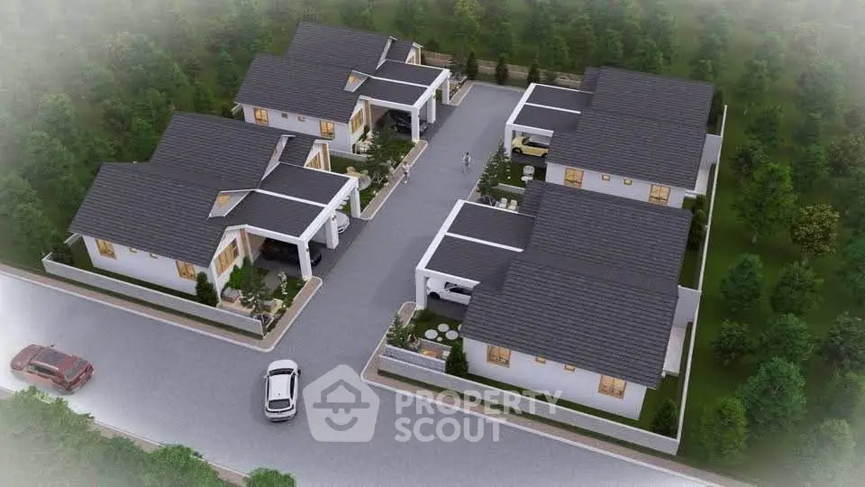 Aerial view of modern residential complex with landscaped surroundings.