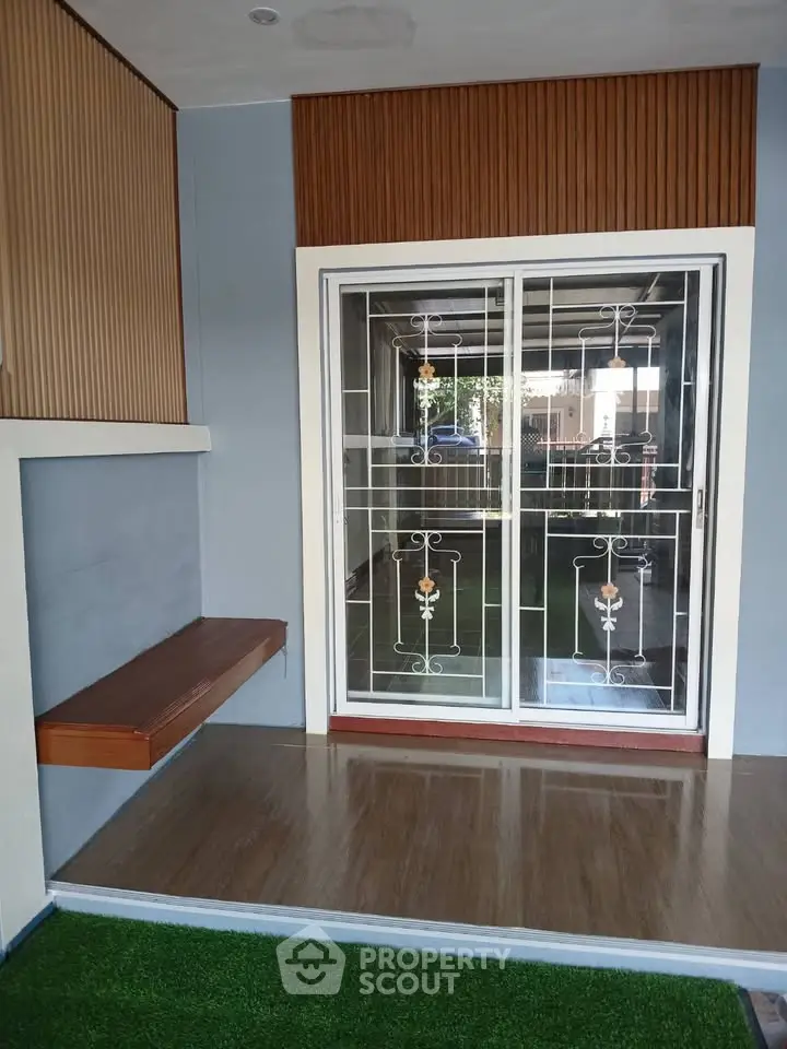 Modern interior with sliding glass doors and wooden accents, perfect for natural light and contemporary living.