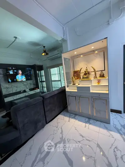 Modern living room with sleek marble flooring and stylish furniture