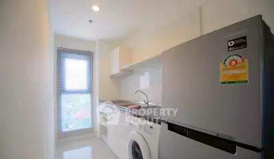 Modern kitchen with sleek appliances and natural light