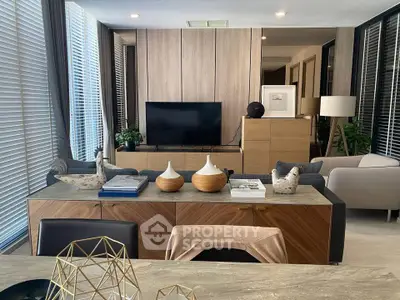 Modern living room with stylish decor and large windows