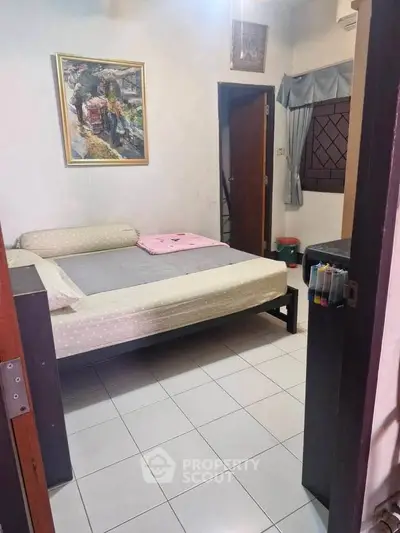 Cozy bedroom with modern decor and comfortable bed in a stylish apartment.