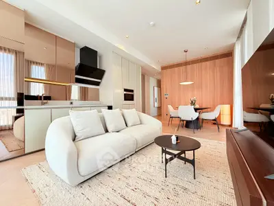 Modern open-plan living room with sleek kitchen and stylish dining area