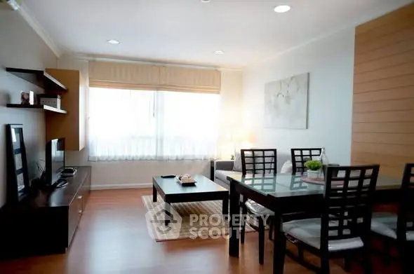 Spacious and modern living room with elegant furniture and natural light.