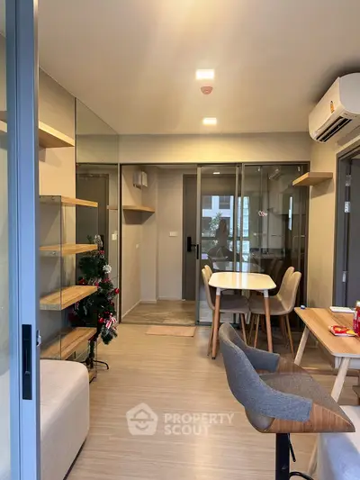 Modern living room with dining area and stylish furniture in a cozy apartment