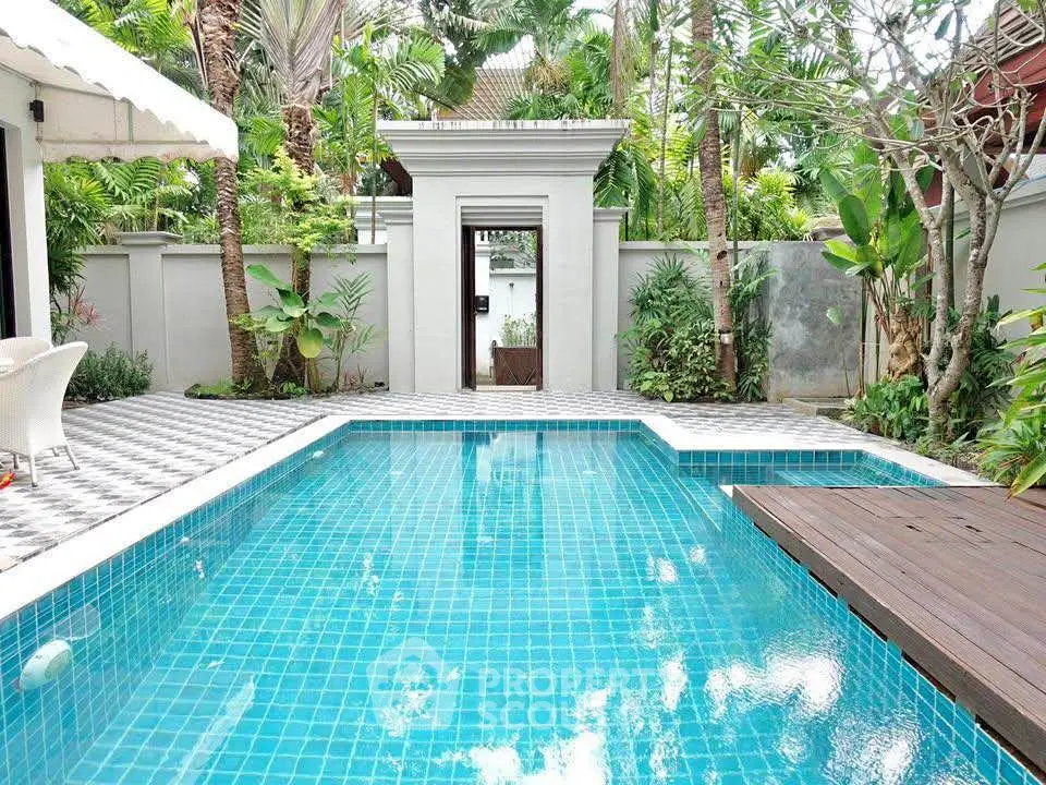 Luxurious private pool in tropical garden setting with elegant patio.