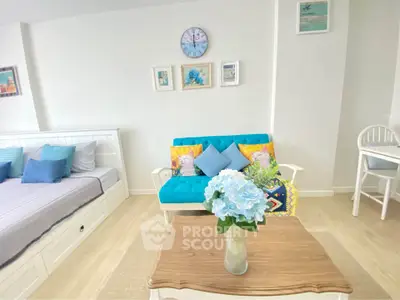 Charming studio apartment with cozy decor and vibrant accents