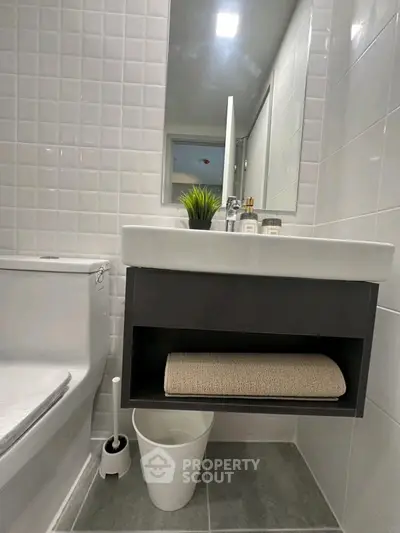 Modern bathroom with sleek sink and stylish tile design