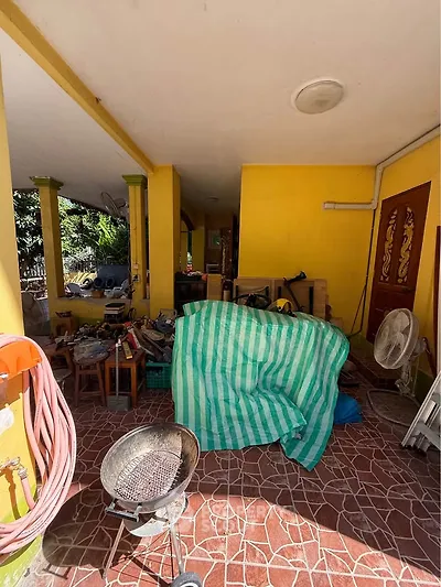 Charming outdoor space with rustic decor and vibrant yellow walls, perfect for creative projects.