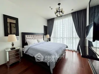 Luxurious bedroom with elegant decor and city view in modern apartment
