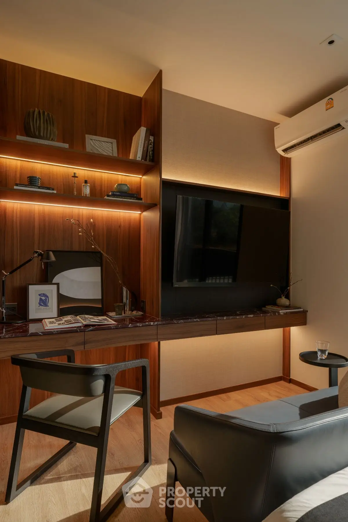 Modern study room with sleek wooden shelves and ambient lighting