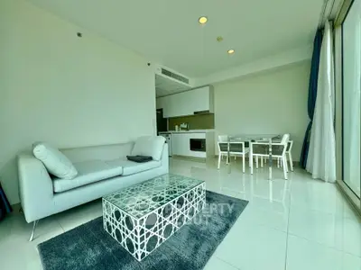 Modern living room with elegant furniture and open kitchen layout