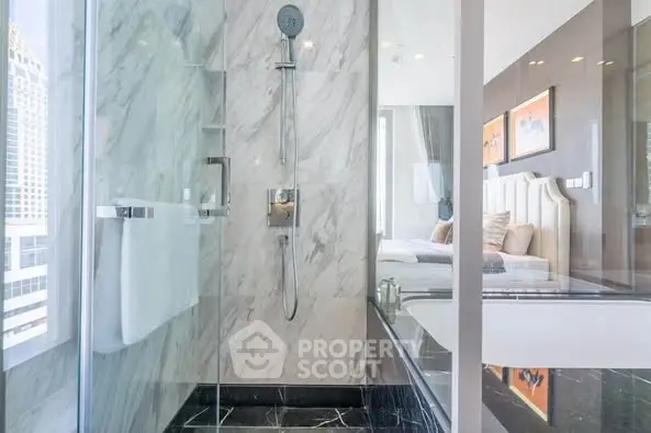 Luxurious modern bathroom with glass shower and elegant marble design