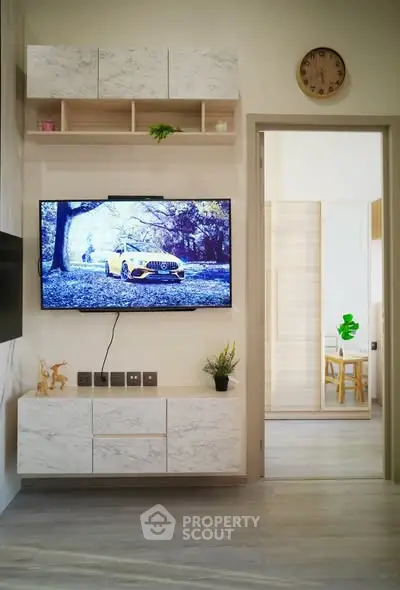 Modern living room with wall-mounted TV and stylish decor