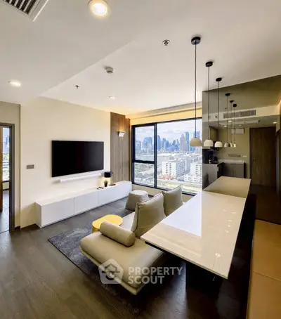 Modern living room with city view, sleek furniture, and open kitchen layout in a high-rise apartment.