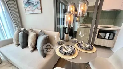 Modern living room with elegant dining setup and stylish lighting