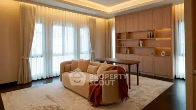 Elegant living room with modern sofa, stylish shelving, and ambient lighting.