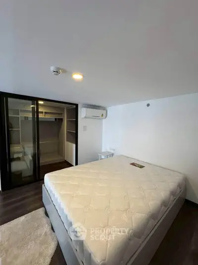 Spacious bedroom with walk-in closet and modern design