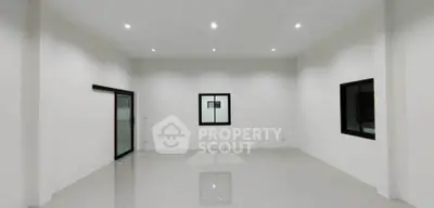 Spacious modern interior with high ceilings and sleek design, ideal for customization.