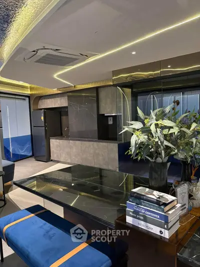 Luxurious modern living room with sleek design and elegant decor, featuring a glass dining table and stylish seating.