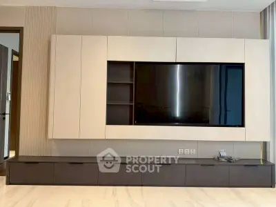 Modern living room with sleek TV unit and elegant decor