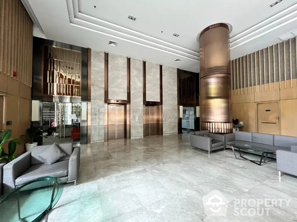 Luxurious building lobby with modern elevators and stylish seating area