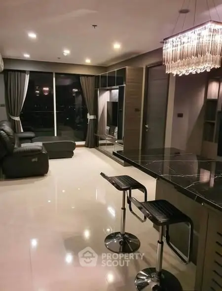 Luxurious modern living room with elegant lighting and city view.