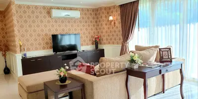 Elegant living room with stylish decor, large windows, and comfortable seating in a modern home.
