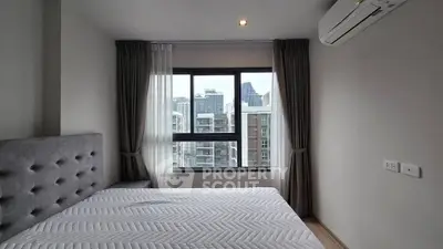 Modern bedroom with city view and air conditioning in high-rise apartment